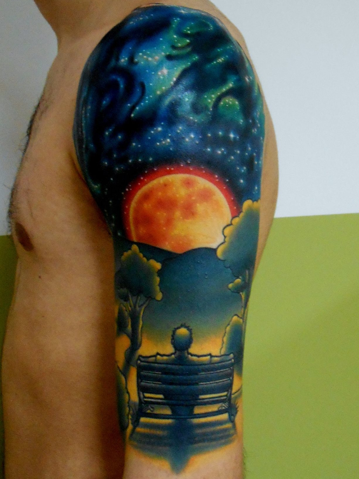 Man on a Bench galaxy space tattoo by Connecticut tattooer Cracker Joe Swider